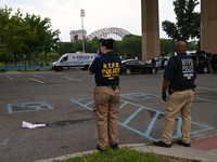 Three people are being shot, with one dead near a New York City-run migrant shelter on Randall's Island in Manhattan, New York, United State...