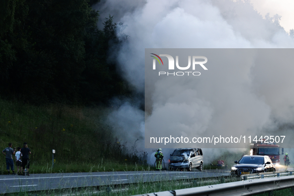 A car is seen on fire at the highway in Belgium on July 28, 2024. 