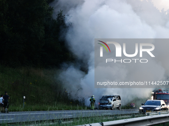 A car is seen on fire at the highway in Belgium on July 28, 2024. (