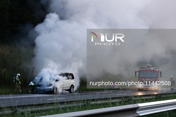 A car is seen on fire at the highway in Belgium on July 28, 2024. 