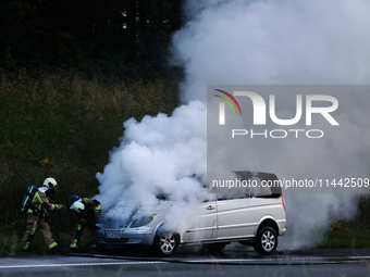 A car is seen on fire at the highway in Belgium on July 28, 2024. (