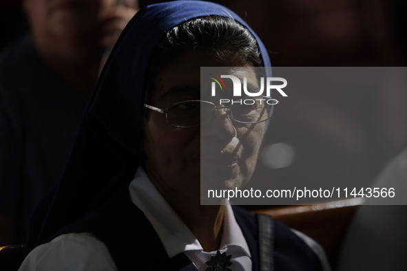 People are participating in a mass where the relics of St. Jude Thaddeus are being exhibited inside the Metropolitan Cathedral in Mexico Cit...