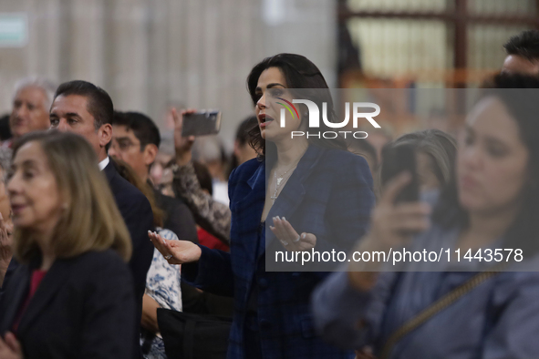 Luz Elena Gonzalez, a Mexican actress, is praying while observing the relics of St. Jude Thaddeus inside the Metropolitan Cathedral in Mexic...