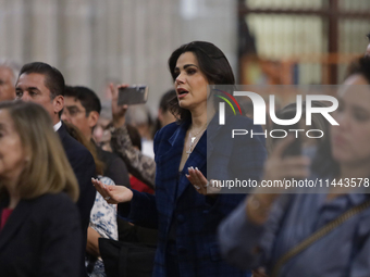 Luz Elena Gonzalez, a Mexican actress, is praying while observing the relics of St. Jude Thaddeus inside the Metropolitan Cathedral in Mexic...