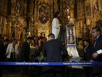 A group of people is arranging relics of St. Jude Thaddeus inside the Metropolitan Cathedral in Mexico City, Mexico, a work being carried ou...