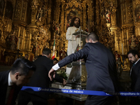 A group of people is arranging relics of St. Jude Thaddeus inside the Metropolitan Cathedral in Mexico City, Mexico, a work being carried ou...