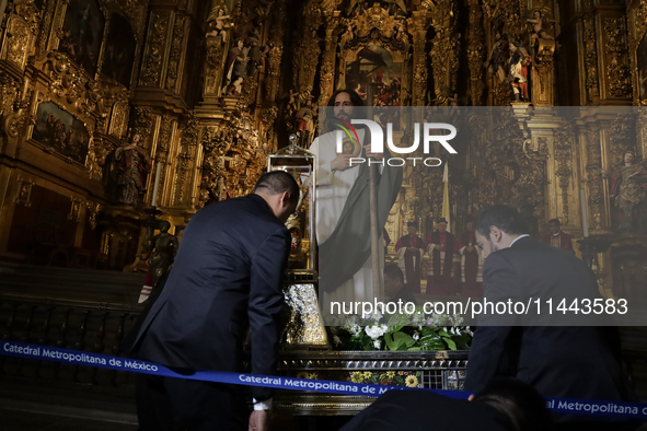 A group of people is arranging relics of St. Jude Thaddeus inside the Metropolitan Cathedral in Mexico City, Mexico, a work being carried ou...