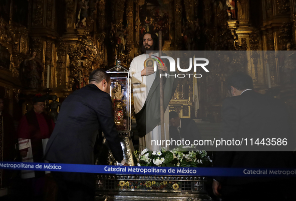 A group of people is arranging relics of St. Jude Thaddeus inside the Metropolitan Cathedral in Mexico City, Mexico, a work being carried ou...