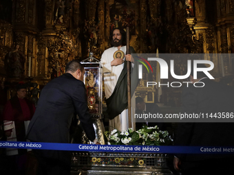 A group of people is arranging relics of St. Jude Thaddeus inside the Metropolitan Cathedral in Mexico City, Mexico, a work being carried ou...