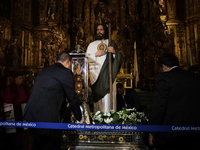 A group of people is arranging relics of St. Jude Thaddeus inside the Metropolitan Cathedral in Mexico City, Mexico, a work being carried ou...