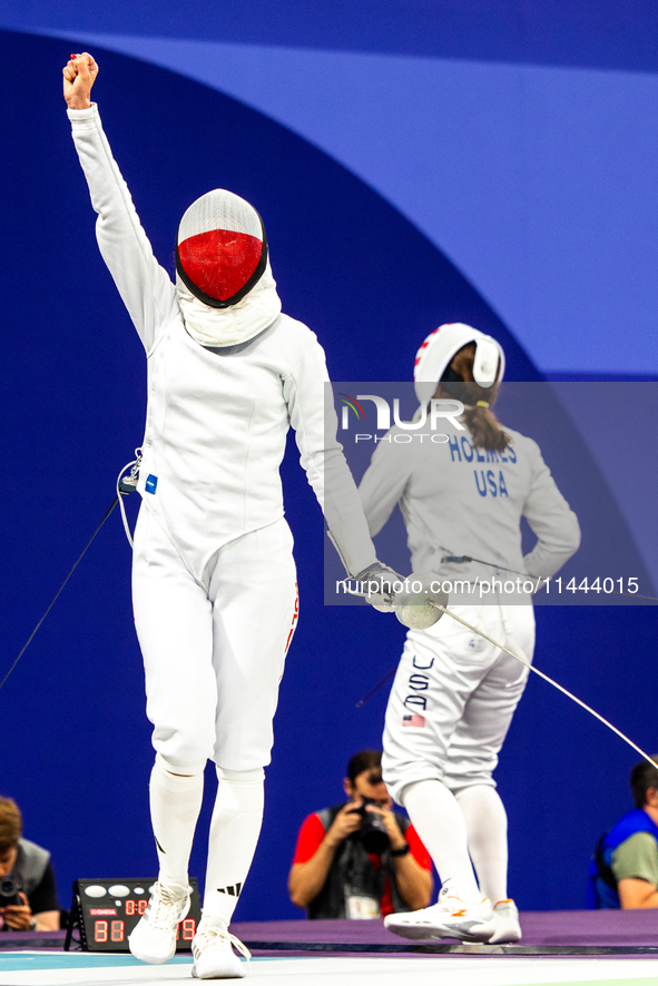 Martyna Swatowska-Wenglarczyk of Team Poland and Hadley Husisian of Team United States compete during the Women's Epee Team Table of 8 match...