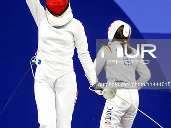 Martyna Swatowska-Wenglarczyk of Team Poland and Hadley Husisian of Team United States compete during the Women's Epee Team Table of 8 match...