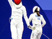 Martyna Swatowska-Wenglarczyk of Team Poland and Hadley Husisian of Team United States compete during the Women's Epee Team Table of 8 match...