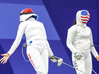 Martyna Swatowska-Wenglarczyk of Team Poland and Hadley Husisian of Team United States compete during the Women's Epee Team Table of 8 match...