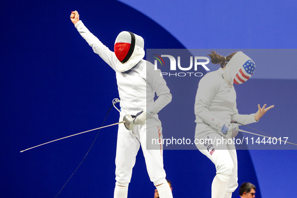 Martyna Swatowska-Wenglarczyk of Team Poland and Hadley Husisian of Team United States compete during the Women's Epee Team Table of 8 match...