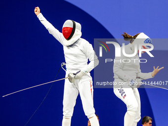 Martyna Swatowska-Wenglarczyk of Team Poland and Hadley Husisian of Team United States compete during the Women's Epee Team Table of 8 match...