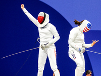 Martyna Swatowska-Wenglarczyk of Team Poland and Hadley Husisian of Team United States compete during the Women's Epee Team Table of 8 match...