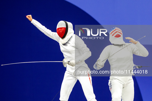 Martyna Swatowska-Wenglarczyk of Team Poland and Hadley Husisian of Team United States compete during the Women's Epee Team Table of 8 match...