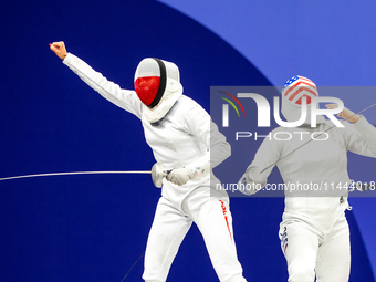 Martyna Swatowska-Wenglarczyk of Team Poland and Hadley Husisian of Team United States compete during the Women's Epee Team Table of 8 match...