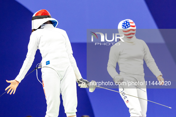 Martyna Swatowska-Wenglarczyk of Team Poland and Hadley Husisian of Team United States compete during the Women's Epee Team Table of 8 match...