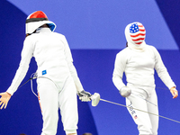 Martyna Swatowska-Wenglarczyk of Team Poland and Hadley Husisian of Team United States compete during the Women's Epee Team Table of 8 match...