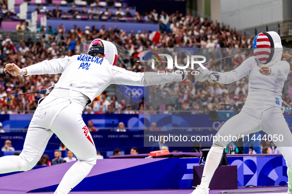 Aleksandra Jarecka of Team Poland and Margherita Guzzi Vincenti of Team United States compete during the Women's Epee Team Table of 8 match...