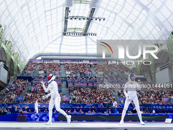 Aleksandra Jarecka of Team Poland and Anne Cebula  of Team United States compete during the Women's Epee Team Table of 8 match between Team...