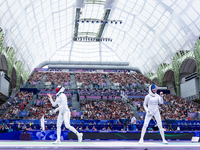 Aleksandra Jarecka of Team Poland and Anne Cebula  of Team United States compete during the Women's Epee Team Table of 8 match between Team...