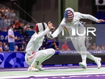 Alicja Klasik  of Team Poland and Margherita Guzzi Vincenti of Team United States compete during the Women's Epee Team Table of 8 match betw...