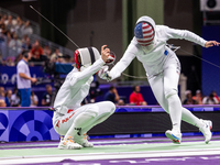 Alicja Klasik  of Team Poland and Margherita Guzzi Vincenti of Team United States compete during the Women's Epee Team Table of 8 match betw...