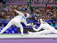 Aleksandra Jarecka of Team Poland and Auriane Mallo - Breton   of France  compete during the Women's Epee Team Semifinal 2, Match 8 match be...