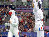 Aleksandra Jarecka of Team Poland and Auriane Mallo - Breton   of France  compete during the Women's Epee Team Semifinal 2, Match 8 match be...