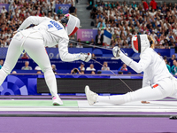 Aleksandra Jarecka of Team Poland and Auriane Mallo - Breton   of France  compete during the Women's Epee Team Semifinal 2, Match 8 match be...