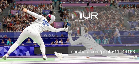 Aleksandra Jarecka of Team Poland and Auriane Mallo - Breton   of France  compete during the Women's Epee Team Semifinal 2, Match 8 match be...