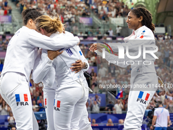 Team France is celebrating victory after the Women's Epee Team Semifinal 2, Match 8 match between Team Poland and Team France  on day four o...