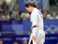 Katharine Holmes of Team United States  reacts after losing a match  during the Women's Epee Team Classifications 5-8, Match 6,  match betwe...