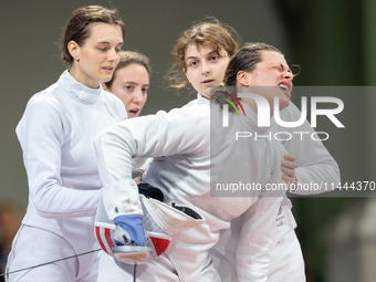 Katharine Holmes of Team United States  reacts after losing a match  during the Women's Epee Team Classifications 5-8, Match 6,  match betwe...