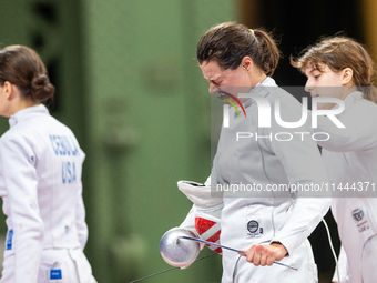 Katharine Holmes of Team United States  reacts after losing a match  during the Women's Epee Team Classifications 5-8, Match 6,  match betwe...