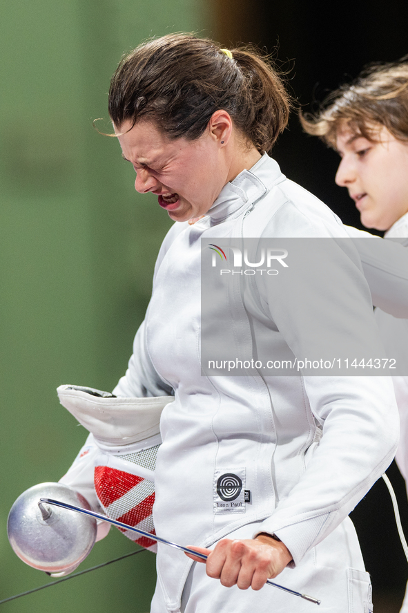 Katharine Holmes of Team United States  reacts after losing a match  during the Women's Epee Team Classifications 5-8, Match 6,  match betwe...