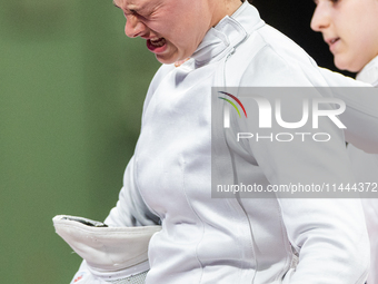 Katharine Holmes of Team United States  reacts after losing a match  during the Women's Epee Team Classifications 5-8, Match 6,  match betwe...