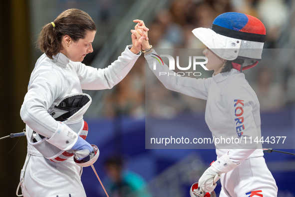 Katharine Holmes of Team United States  and Sera Song  of Republic of Korea compete during the Women's Epee Team Classifications 5-8, Match...