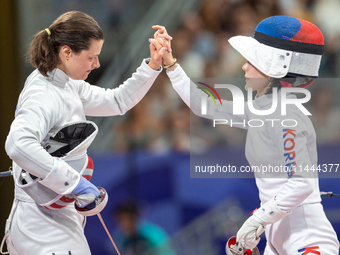 Katharine Holmes of Team United States  and Sera Song  of Republic of Korea compete during the Women's Epee Team Classifications 5-8, Match...