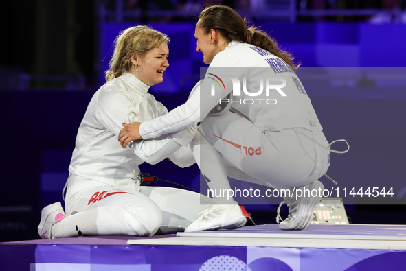 Aleksandra Jarecka, Martyna Swatowska, Wglarczyk,  of Team Poland is  celebrate victory after the bronze medal match in women's 11 rowing be...