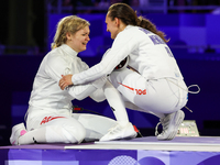 Aleksandra Jarecka, Martyna Swatowska, Wglarczyk,  of Team Poland is  celebrate victory after the bronze medal match in women's 11 rowing be...