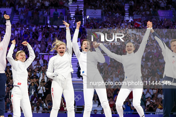 Aleksandra Jarecka, Martyna Swatowska Wglarczyk, Renata Knapik-Miazga, and Aleksandra Klasik  of Team Poland is  celebrate victory after the...