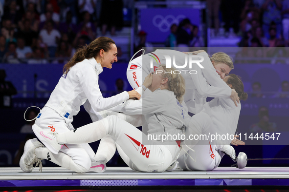 Aleksandra Jarecka, Martyna Swatowska Wglarczyk, Renata Knapik-Miazga, and Aleksandra Klasik  of Team Poland is  celebrate victory after the...