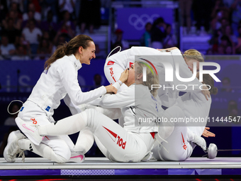 Aleksandra Jarecka, Martyna Swatowska Wglarczyk, Renata Knapik-Miazga, and Aleksandra Klasik  of Team Poland is  celebrate victory after the...