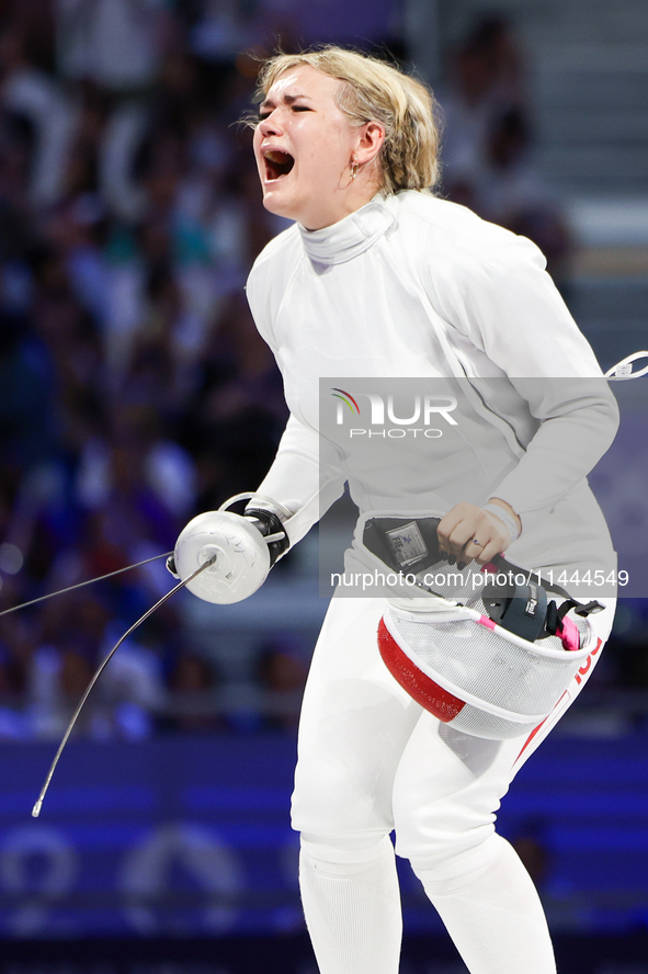 Aleksandra Jarecka,  is  celebrating  victory after the bronze medal match in women's 11 rowing between the Polish national team and the Chi...