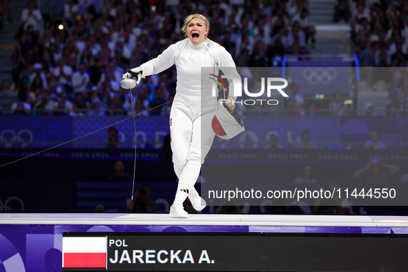 Aleksandra Jarecka,  is  celebrating  victory after the bronze medal match in women's 11 rowing between the Polish national team and the Chi...