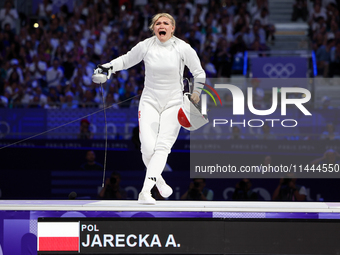 Aleksandra Jarecka,  is  celebrating  victory after the bronze medal match in women's 11 rowing between the Polish national team and the Chi...